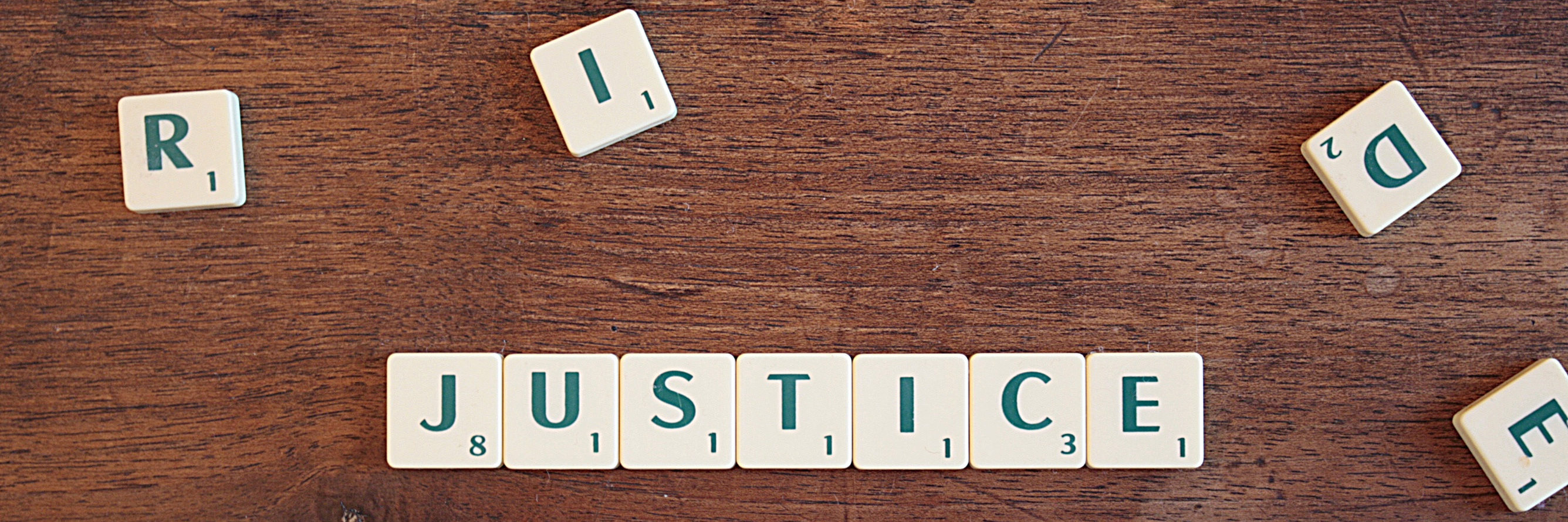 The word justice is laid out as a letter puzzle